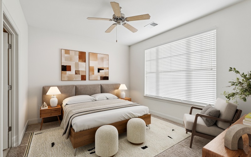 Bedroom with large window and picture on wall